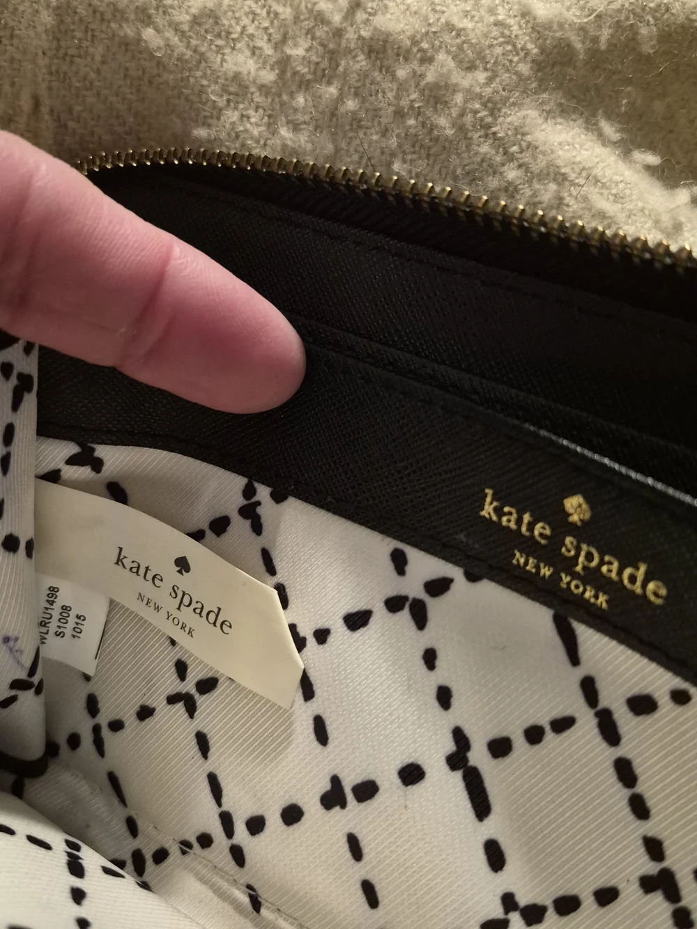 kate spade Newbury Lane Zip around black wallet with gold logo plaque